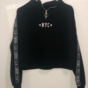 Black crew neck crop top.